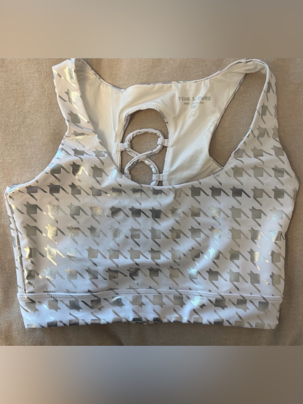 White and silver patterned sports bra